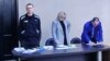 Jailed Russian opposition leader Alexei Navalny attends a court hearing in Pokrov
