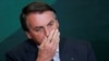 El presidente de Brasil, Jair Bolsonaro, reacciona durante la ceremonia de lanzamiento del Programa Nacional de Crecimiento Verde, en el Palacio Planalto en Brasilia, Brasil, el 25 de octubre de 2021.