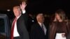 U.S. President Donald Trump and first lady Melania Trump disembark from Air Force One upon arrival at Ezeiza International Airport in Buenos Aires, Argentina, Nov. 29, 2018, as they travel to attend the G20 summit.