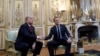 President Donald Trump shakes hands with French President Emmanuel Macron inside the Elysee Palace in Paris Saturday Nov. 10, 2018.