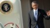 FILE - President Barack Obama waves as he steps off Air Force One.