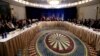 U.S. Secretary of State John Kerry, United Nations secretary general Ban Ki-moon and Russian foreign minister Sergey Lavrov (C) sit with other ministers and delegates at the start a meeting on Syria in New York, Dec. 18, 2015 .