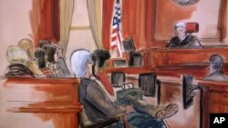 In this courtroom drawing, Judge Richard Berman addresses the jury at the end of the day's deliberations in the corruption trial of Halkbank executive Mehmet Hakan Atilla, Dec. 22, 2017.