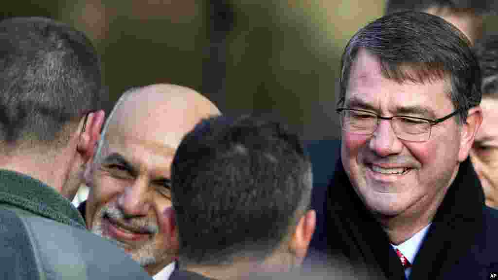 Defense Secretary Ashton Carter (right) and Afghanistan's President Ashraf Ghani shake hands with service members after speaking at the Pentagon, March 23, 2015.