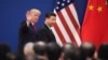 FILE - U.S. President Donald Trump and China's President Xi Jinping leave a business leaders event at the Great Hall of the People in Beijing, Nov. 9, 2017.