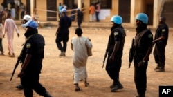 FILE - U.N. peacekeepers are seen on patrol in Bangui, capital of the Central African Republic, Feb. 14, 2016. The U.N. announced Wednesday that the Congo Republic will withdraw its troops from a peacekeeping mission in CAR amid sexual abuse allegations against its troops.