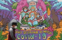 Mural kesadaran bahaya COVID-19 di Jakarta, 20 November 2021.