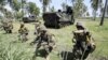 U.S. Marines take their position during a joint amphibious assault exercise with their Indonesian counterparts on Banongan beach in Situbondo, East Java, Indonesia, June 5, 2012. 