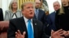 President Donald Trump speaks in the Oval Office at the White House in Washington, Feb. 19, 2019. 