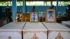 Portraits of young victims of a mass shooting in a nursery are displayed atop their coffins as funeral preparations get underway at Wat Si Uthai temple in Thailand's northeastern Nong Bua Lam Phu province.