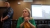 FILE - Former Russian state TV employee Marina Ovsyannikova, who staged an anti-war protest on live state television in March, attends a court hearing in Moscow, Russia, July 28, 2022. 