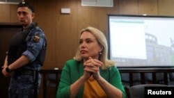 FILE - Former Russian state TV employee Marina Ovsyannikova, who staged an anti-war protest on live state television in March, attends a court hearing in Moscow, Russia, July 28, 2022. 