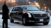 A presidential limo known as "The Beast" carrying President Donald Trump and first lady Melania Trump arrives outside Blair House across the street from the White House in Washington, Dec. 4, 2018.