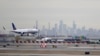 FILE - A United Airlines jet prepares to land on Jan. 23, 2019, at Newark (N.J.) Liberty International Airport, one of five U.S. airports where travelers from Uganda will be diverted to screen for Ebola. 