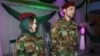صمیم جباری و همسرش که در شب عروسی شان لباس نظامی پوشیده اند