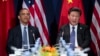 FILE - President Barack Obama, left, meets with Chinese President Xi Jinping.