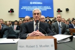 Former special counsel Robert Mueller listens to committee members give their opening remarks before he testifies before the House Intelligence Committee on his report on Russian election interference, on Capitol Hill, in Washington, July 24, 2019.