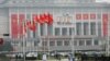 People walk near the venue of a ruling party congress in Pyongyang, North Korea, May 6, 2016. 