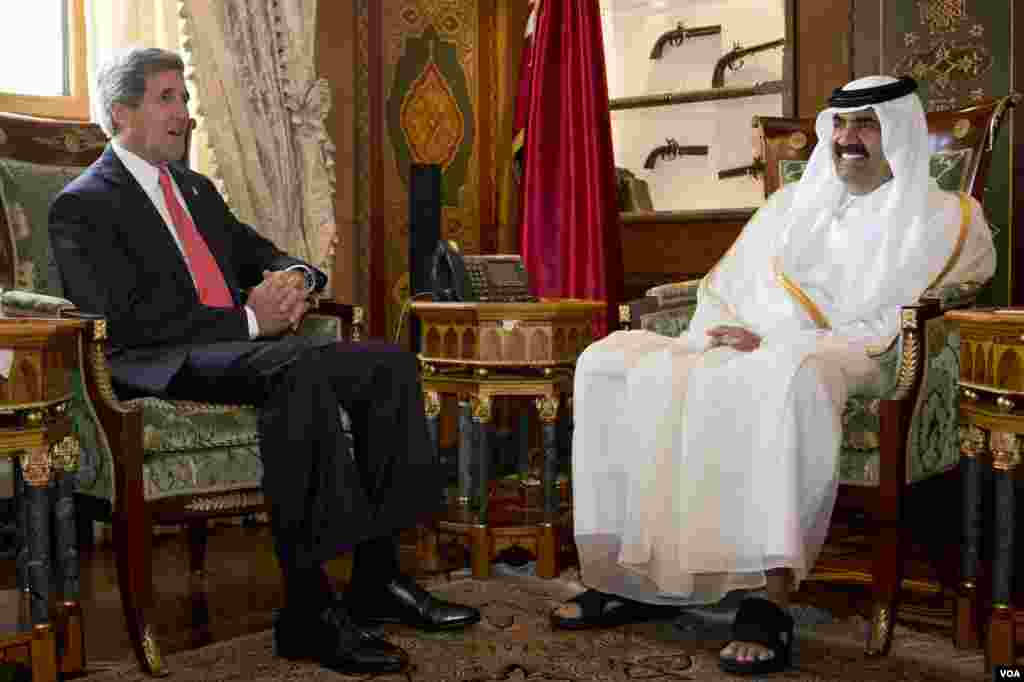 U.S. Secretary of State John Kerry, left, meets with Qatari Emir Hamad bin Khalifa al-Thani at Wajbah Palace in Doha, Qatar, June 23, 2013.