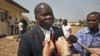 Head of the Central African Republic's government delegation to the peace talks, Jean Willybiro Sako, speaks to the media at the airport in Bangui, Central African Republic Monday, Jan. 7, 2013.
