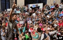 Egyptians shout slogans against Egyptian President Abdel-Fattah el-Sissi during a protest against the decision to hand over control of two strategic Red Sea islands to Saudi Arabia in front of the Press Syndicate, in Cairo, Egypt, Friday, April 15, 2016.