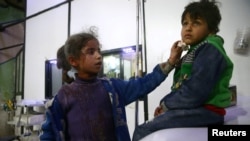 Des enfants blessés dans un hôpital de Douma pendant la guerre, Ghouta orientale, Syrie, le 23 février 2018.