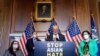 Senate Majority Leader Chuck Schumer (D-NY) is joined by fellow Democrats as he speaks at a news conference after the Senate passed the COVID-19 Hate Crimes Act on Capitol Hill in Washington, April 22, 2021. 