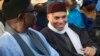Karim Wade (R), son of Senegal's former president Abdoulaye Wade, attends a rally by his father's political party Parti Democratique Senegalais (PDS) in Dakar, Dec. 6, 2012. 