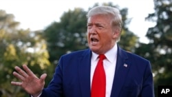 FILE - President Donald Trump speaks to members of the media on the South Lawn of the White House in Washington, Oct. 10, 2019. 