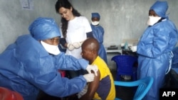 This handout picture released by Doctors Without Borders (MSF) Nov. 14, 2019, shows a man receiving his first injection of the new Ebola vaccine, at the MSF facilities in Goma, North Kivu province, DRC.