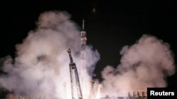 The Soyuz TMA-14M spacecraft carrying the International Space Station crew of Barry Wilmore of the U.S., and Alexander Samokutyaev and Elena Serova of Russia blasts off from the launch pad at the Baikonur cosmodrome, September 26, 2014.