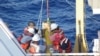 Personnel aboard the NOAA ship, Thomas Jefferson, prepare to launch a glider that belongs to the Naval Oceanographic Office as part of a Gulf of Mexico Loop Current research cruise.