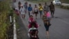 Central American migrants traveling with a caravan to the U.S. make their way to Pijijiapan, Mexico, Oct. 25, 2018. 