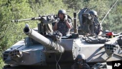 Des soldats de l'armée sud-coréenne à bord de chars K-1 au cours d'un exercice militaire annuel à Paju, Corée du Sud, près de la frontière avec la Corée du Nord, le 22 août 2016.
