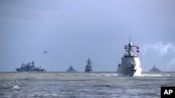 FILE - In this photo released by Xinhua News Agency, Chinese and Russian warships take part in a joint naval drills in the East China Sea, Dec. 27, 2022. China’s Defense Ministry, announced on Sept. 9. 2024, joint naval and air drills with Russia starting this month.