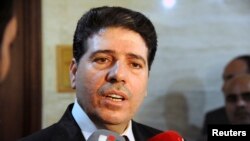 Perdana Menteri Suriah Wael al-Halki berbicara kepada wartawan di Damaskus (foto: dok).