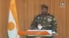 This video frame grab image obtained by AFP from ORTN - Télé Sahel on August 19, 2023 shows Niger's new military ruler General Abdourahamane Tiani, reading a statement on national television.