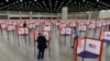 FILE - In this June 23, 2020, photo voting stations are set up in the South Wing of the Kentucky Exposition Center for voters to cast their ballot in the Kentucky primary in Louisville, Ky. 