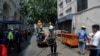 Members of the Myanmar Red Cross Society disinfect a street as a preventive measure 