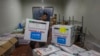 A worker unloads a shipment of polio vaccines provided with support from UNICEF to the Gaza Strip through the Karm Abu Salem crossing, also known as Kerem Shalom, at a depot belonging to Gaza's Health Ministry on Aug. 25, 2024.