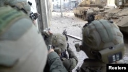 Soldiers of Israel's Paratroopers Brigade take part in an operation at a location given as Gaza
