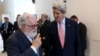 European Union Climate Commissioner Miguel Arias Canete (L) welcomes US Secretary of State John Kerry for talks to reduce hydrofluorocarbons under the Montreal Protocol at Vienna International Center in Vienna, Austria, July 22, 2016.