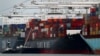 The Yang Ming shipping line container ship Ym Utmost is unloaded at the Port of Oakland, July 2, 2018, in Oakland, Calif. 