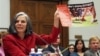 U.S. Centers for Disease Control (CDC) Director Julie Gerberding holds up a staph awareness poster while testifying before the House Committee on Oversight and Government Reform Committee hearing on drug-resistant infections and the consequences for publi