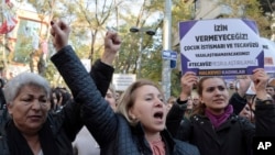 Turkish women stage a protest in Ankara, Turkey, Nov. 19, 2016, after a debate flared in Turkey after a government proposal which would pardon some people imprisoned for statutory rape, fell short of passage by legislators. 