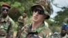 U.S. Army special forces Captain Gregory, 29, from Texas, center, who would only give his first name in accordance with special forces security guidelines, speaks with troops from the Central African Republic and Uganda, in Obo, Central African Republic, 