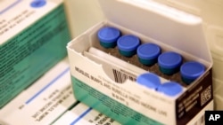 FILE - Measles, mumps and rubella vaccines are seen in a cooler at the Rockland County Health Department in Pomona, New York, March 27, 2019. 