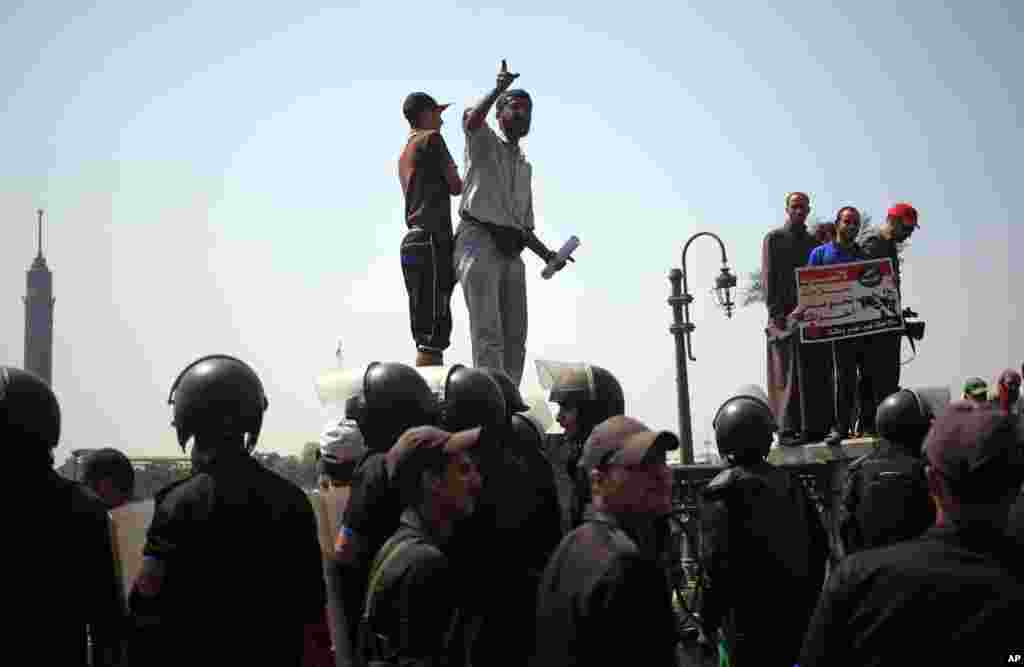 Supporters of Egypt's ousted President Mohamed Morsi, demonstrate near Tahrir Square in Cairo, July 17, 2013.