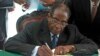 Zimbabwe President Robert Mugabe signs Zimbabwe's new constitution into law in Harare, May 22, 2013.