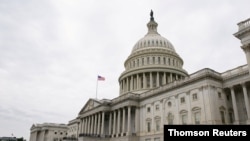 FILE PHOTO: Vehicles are parked outside the U.S. Capitol building the morning the Senate returned to session in Washington